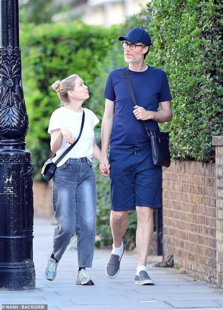 Stephen Merchant and his partner Mircea Monroe wear padded jackets for